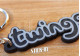 Renault Twingo Schlüsselanhänger mit Monogramm und Kofferraum-Logo aus weichem, schwarzem PVC