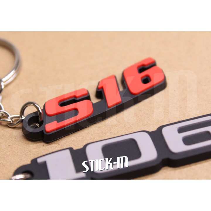 Pack of 2 Peugeot 106 + S16 keychains in soft PVC with monograms and logos