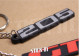 2er-Pack Peugeot 205 + GTI Schlüsselanhänger aus weichem PVC mit Monogrammen und Logos