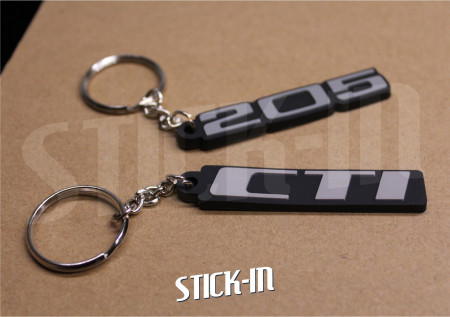 Pack 2 Schlüsselanhänger – Peugeot 205 + CTI – Monogramm-Logos aus Weich-PVC